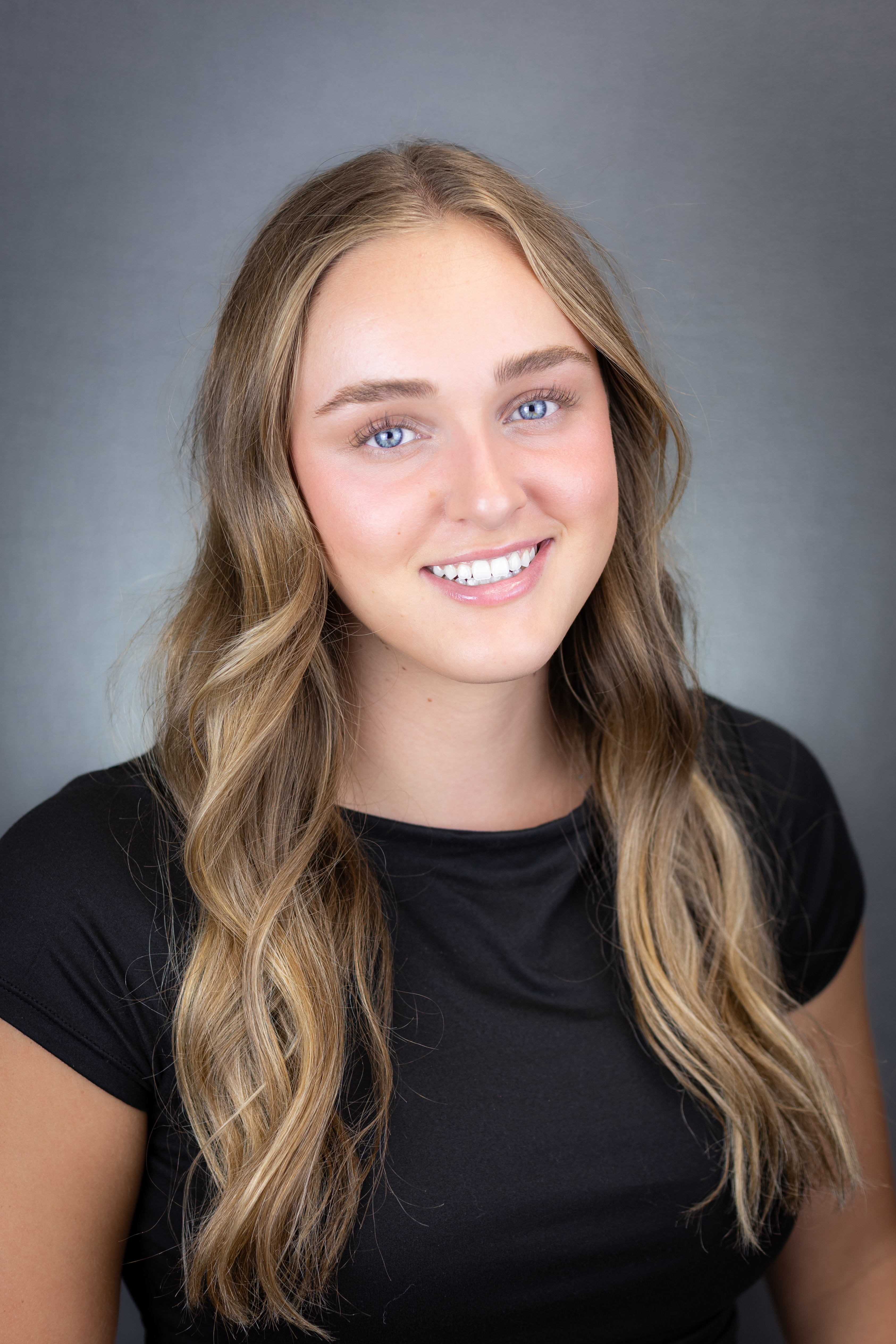 Headshot photo of Ellie